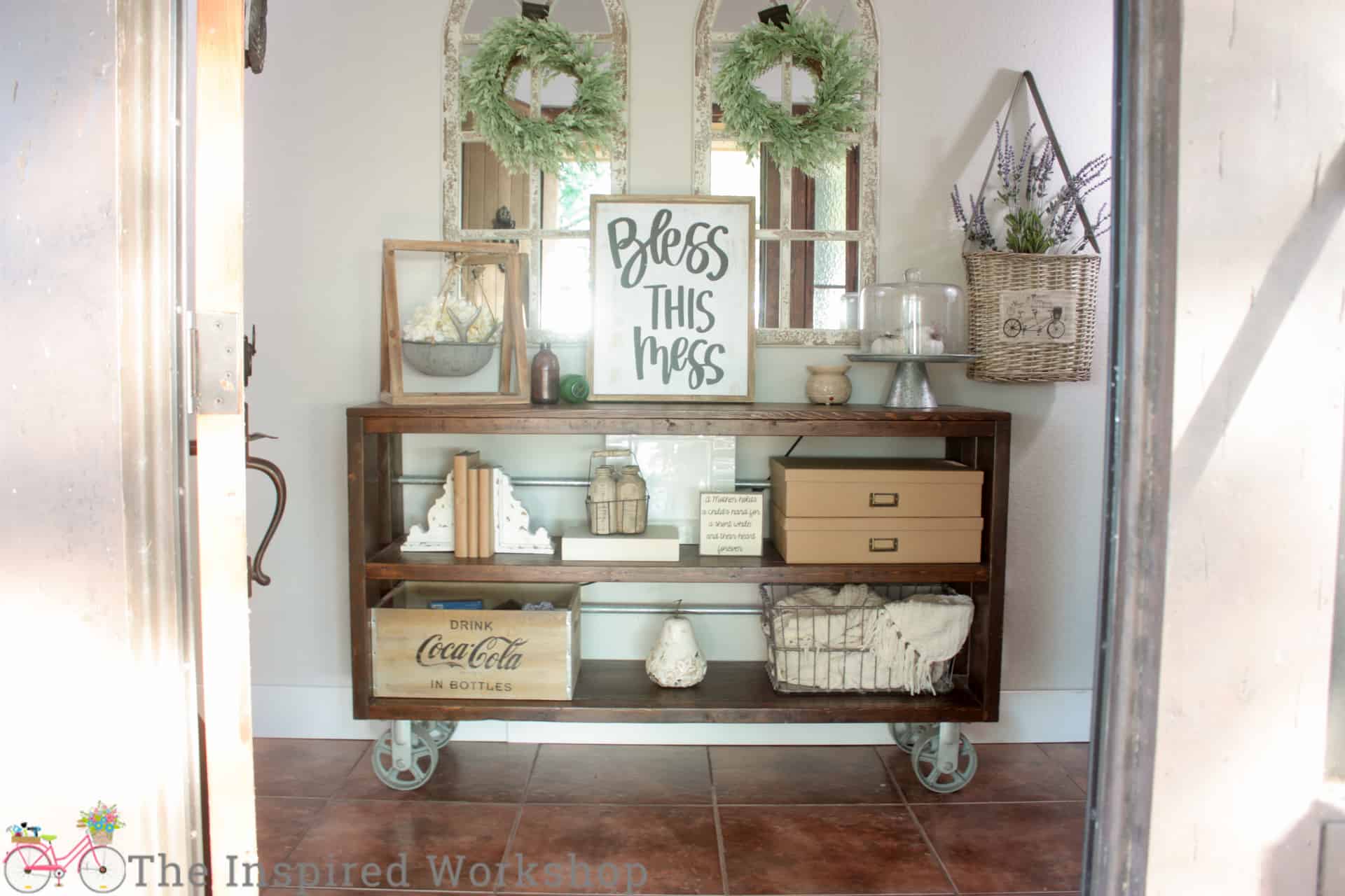 DIY console table decorated with books and brown boxes for storage