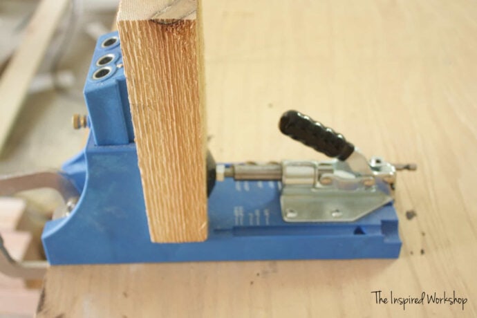 board clamped in a kreg jig k4 to show how to set up the kreg jig