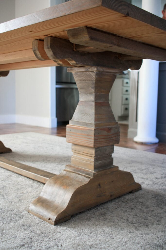 Table leg of the trestle table looks like a fancy turned leg but it is stacked wood