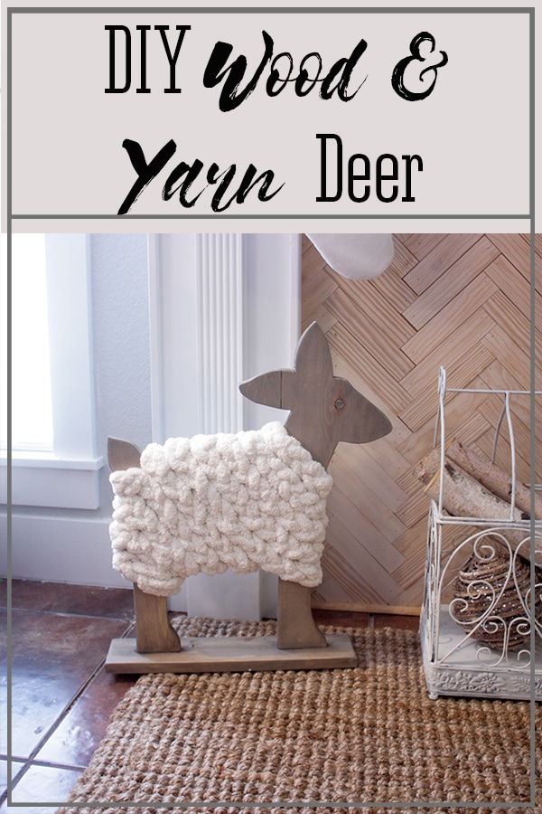 DIY Wood Deer with yarn body looking so cute by the fireplace