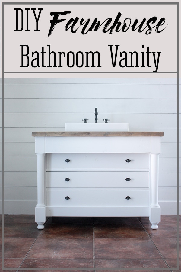 Farmhouse DIY bathroom vanity sitting in front of white shiplap wall