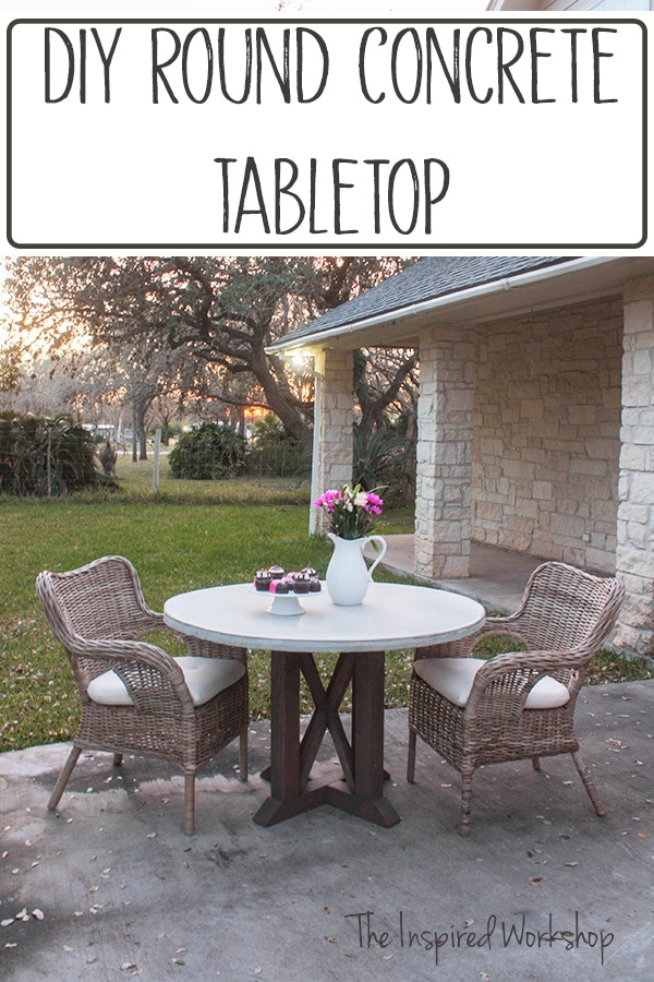 Pedestal table with concrete top and two wicker chairs, a white pitcher sitting on table with flowers in it and cupcakes