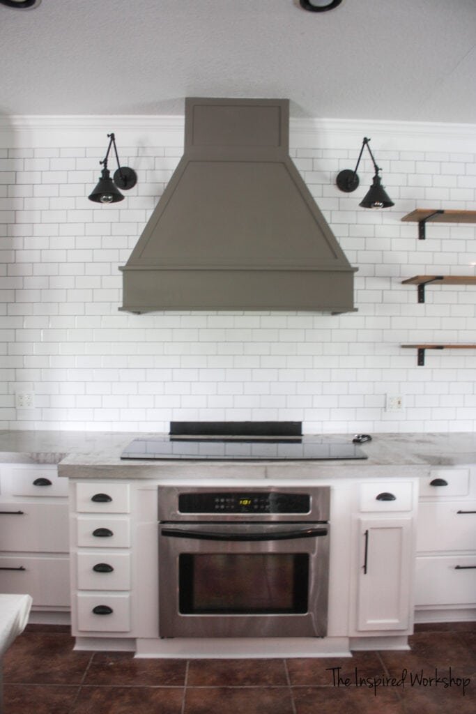 DIY Vent Hood completed Gauntlet gray and has subway tiles and white cabinet