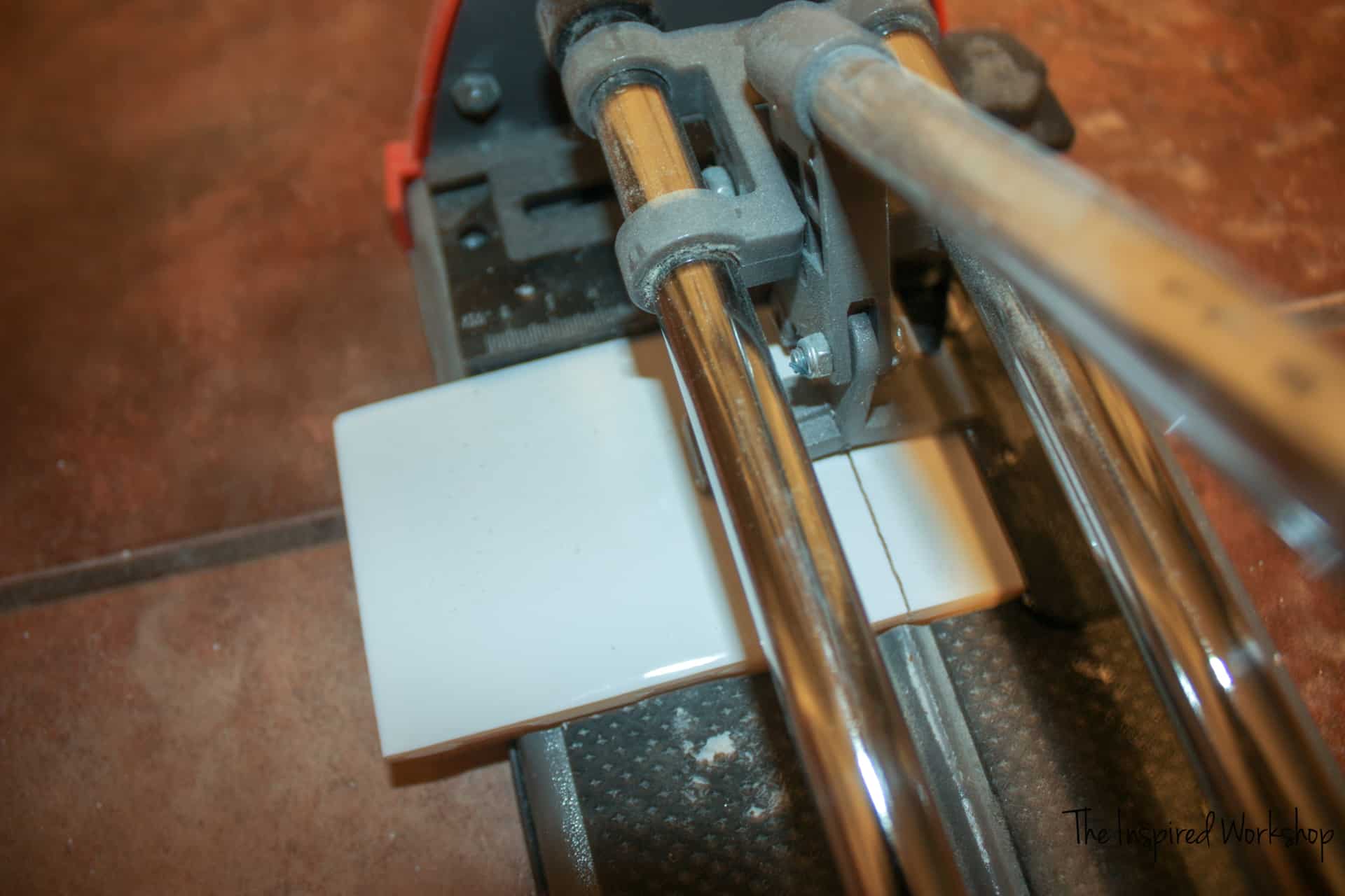 Cutting tile with a tile cutter