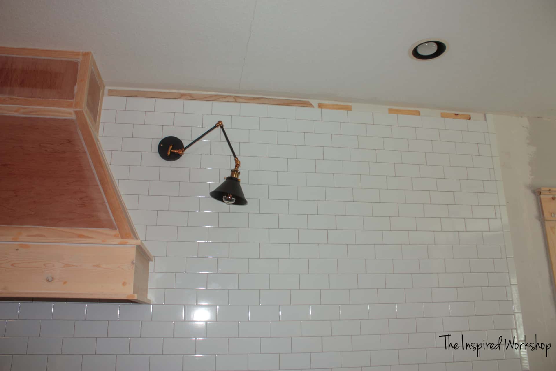 Tiling a wall with an uneven ceiling