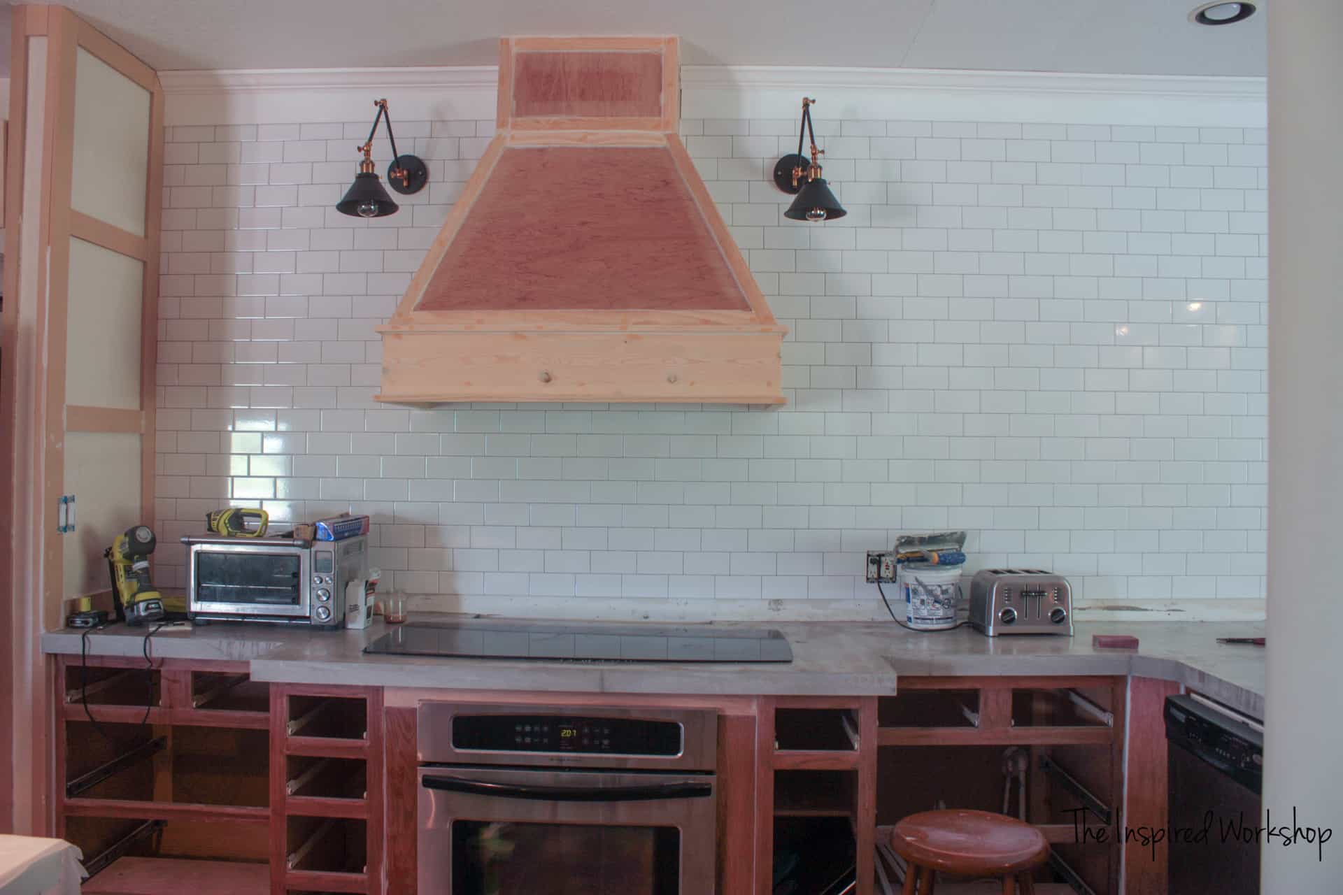 How to Tile A Kitchen Wall - Adding crown molding to distract from an unlevel ceiling