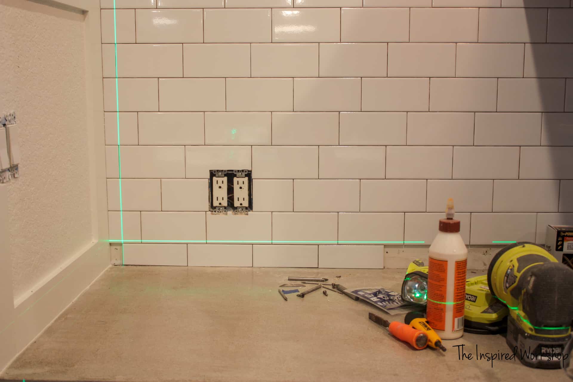 Using a laser level to get tiles straight