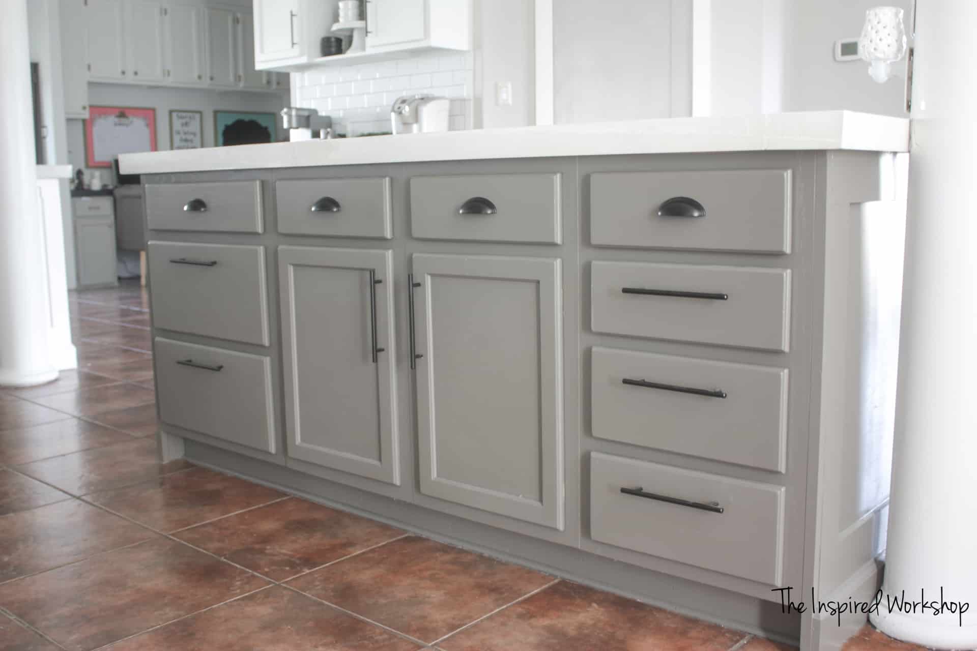 Kitchen Renovation with white painted cabinets and gray island