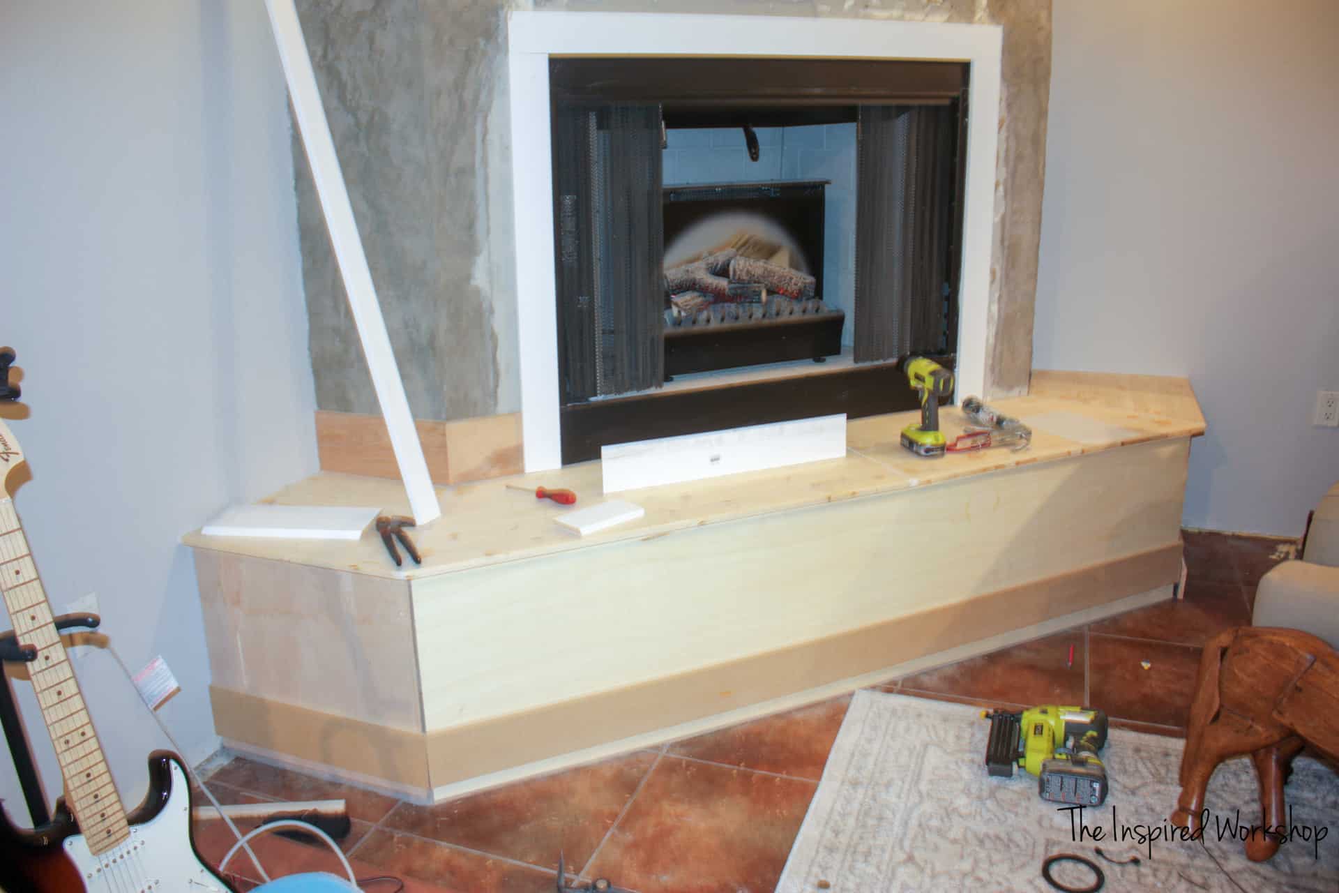 Adding the trim molding to the hearth tools everywhere and fireplace mid makeover and baseboards