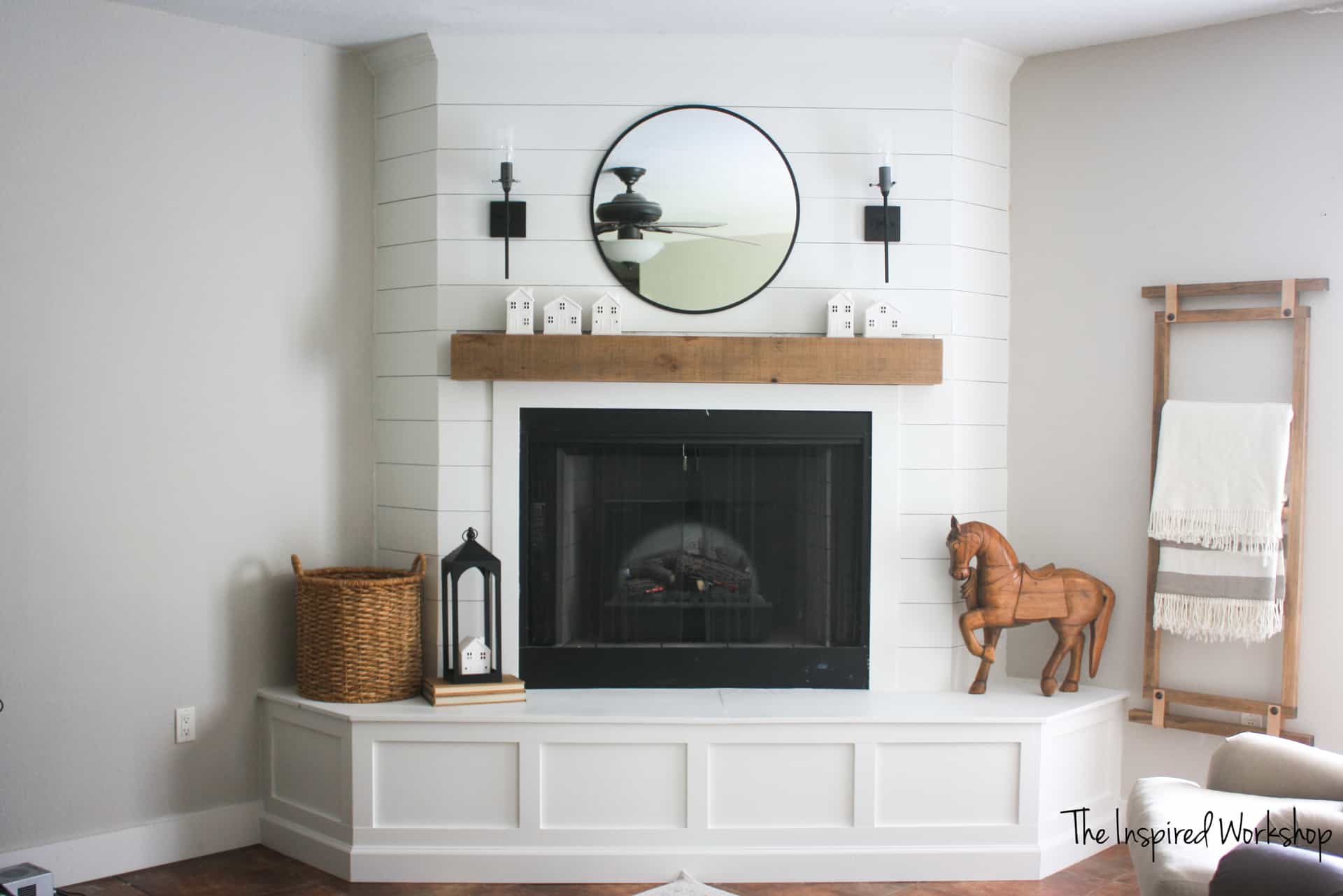 DIY Fireplace Makeover - Shiplapped the top of the fireplace and created molding around the hearth to cover the concrete that was beneath!