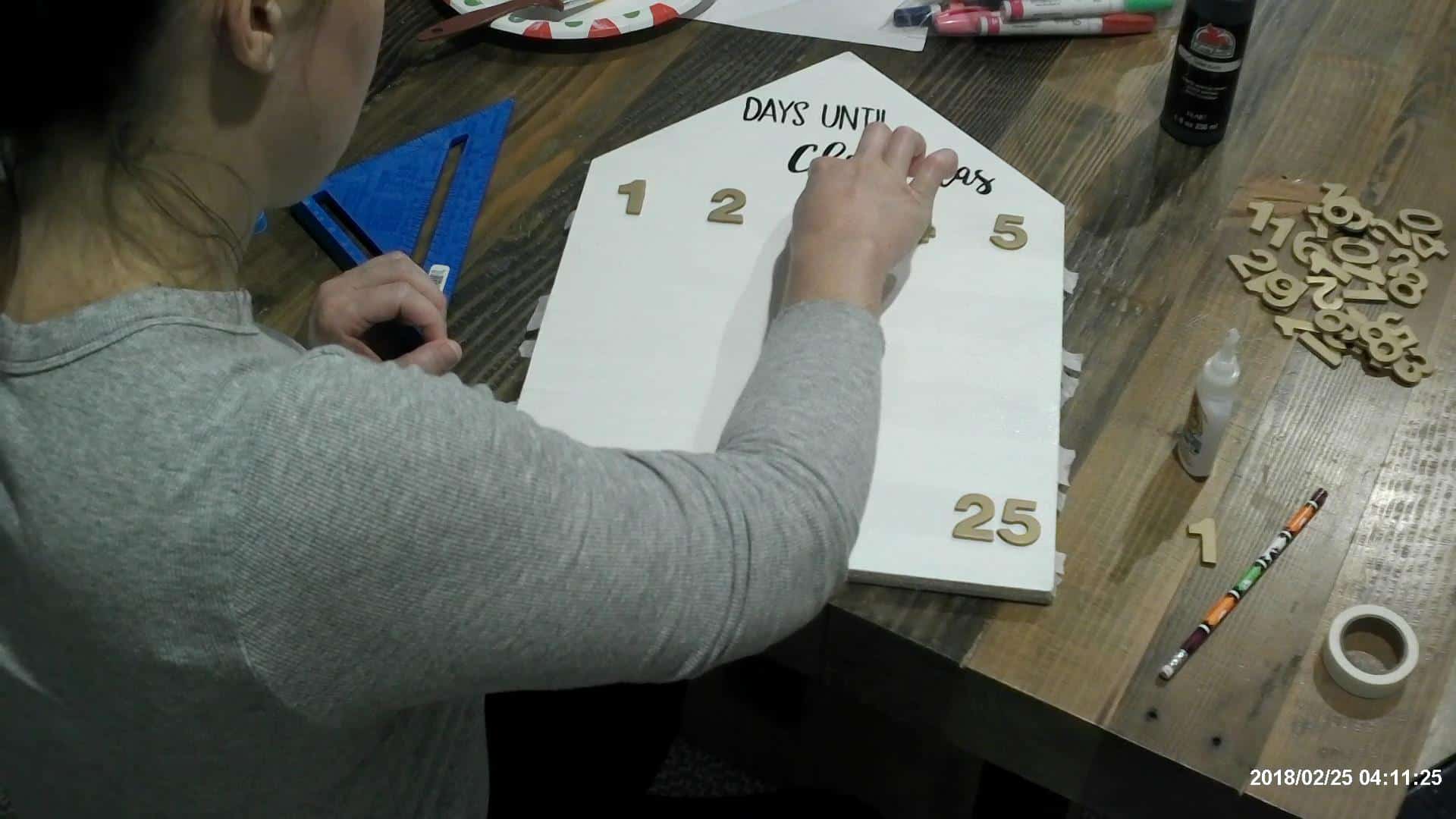 Adding the numbers to the advent calendar board