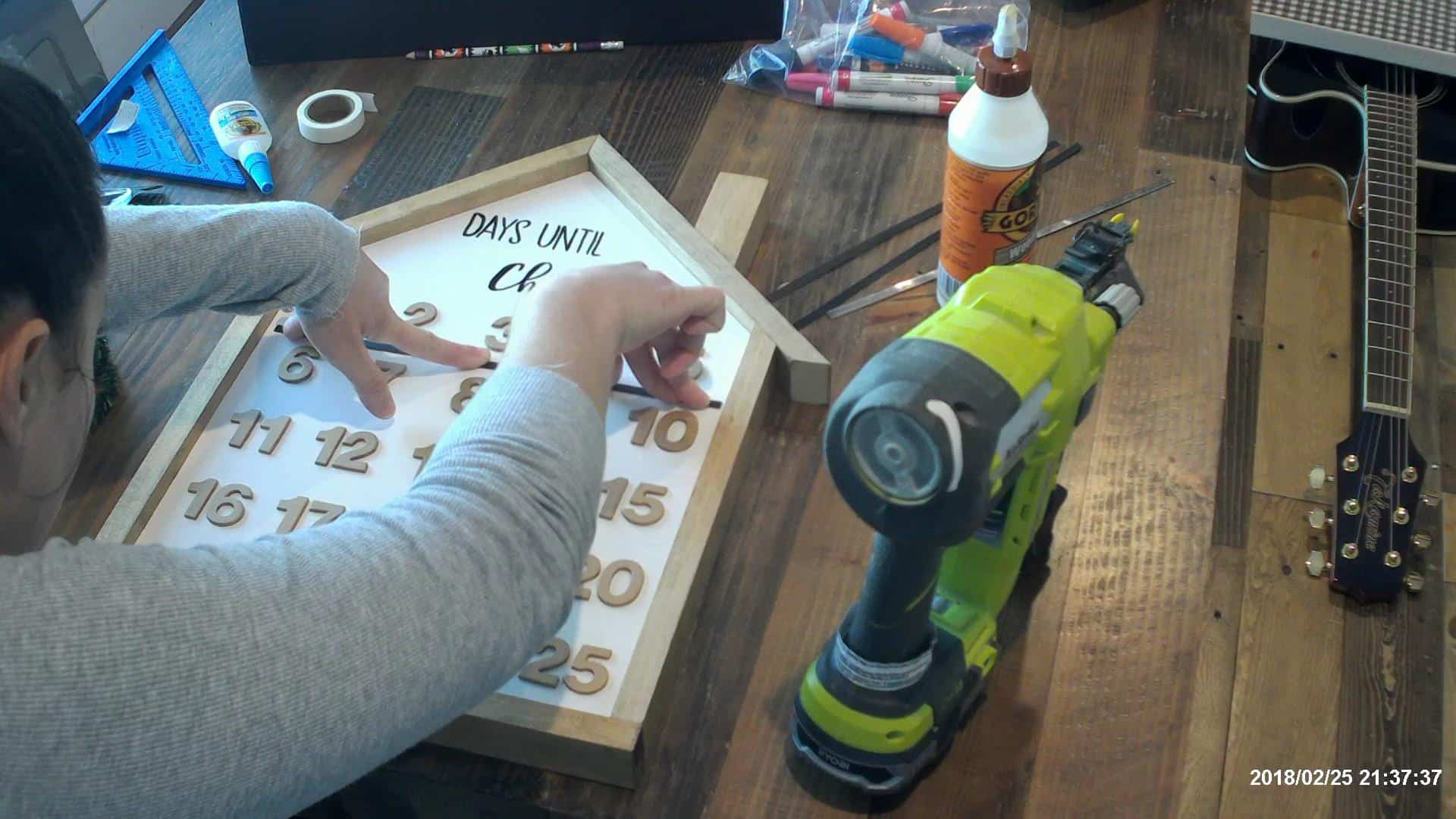 Adding the metal strips to the house advent calendar