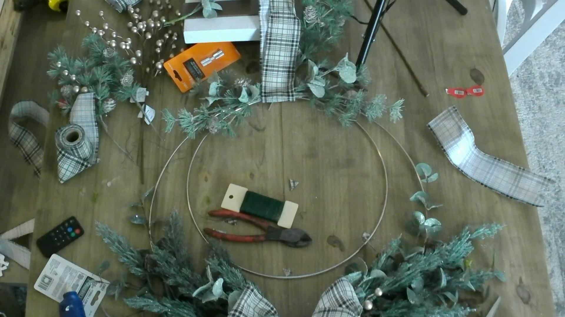 Adding the stems to the top of the DIY Christmas Wreath