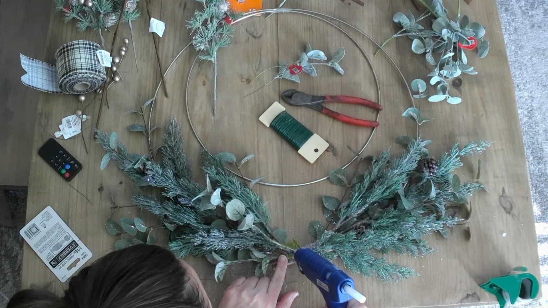 Making the DIY Christmas Wreath with metal hoop