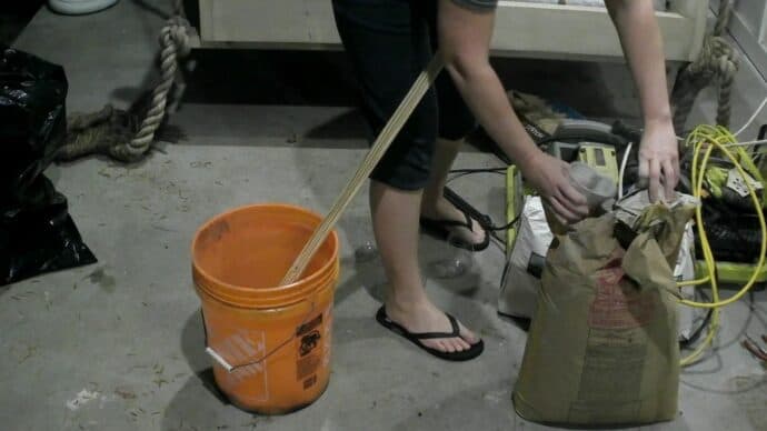 Mixing up the concrete for the gnome bodies for the stocking holders