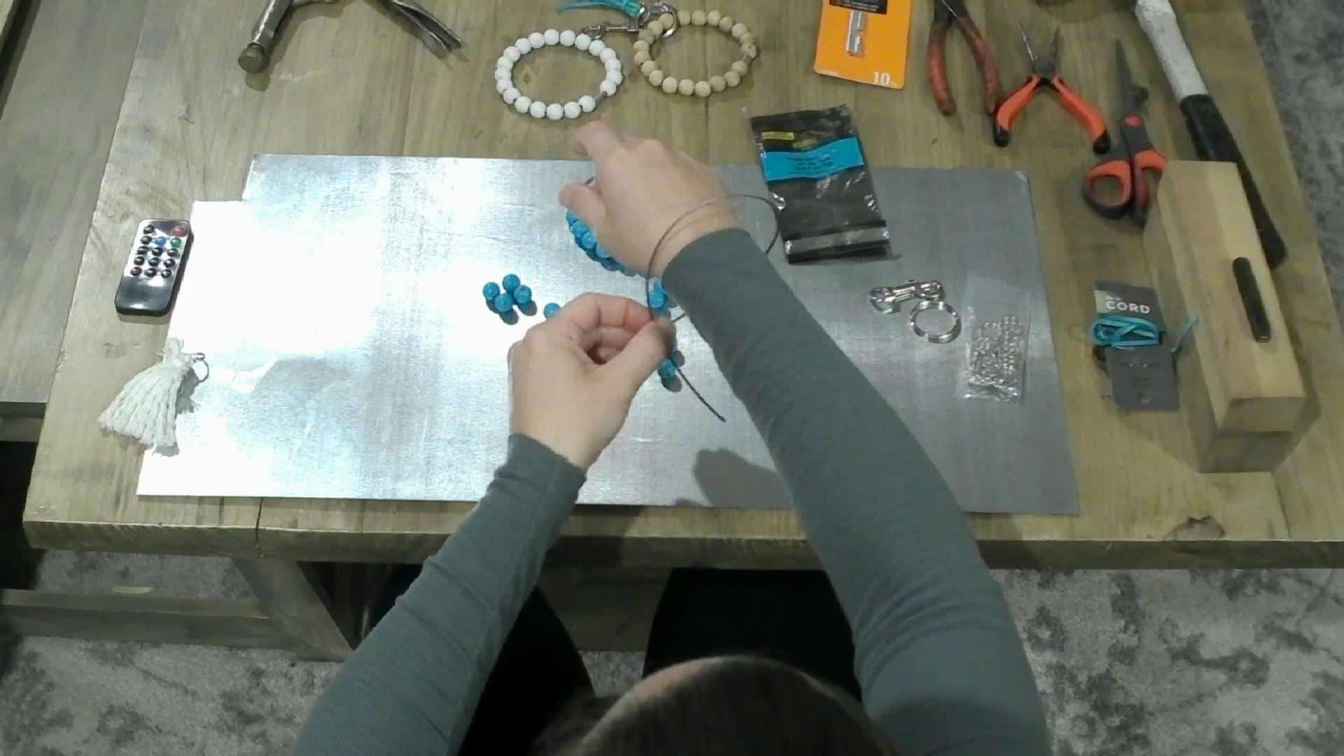 Measuring the wire for the DIY Key Chain Bracelet