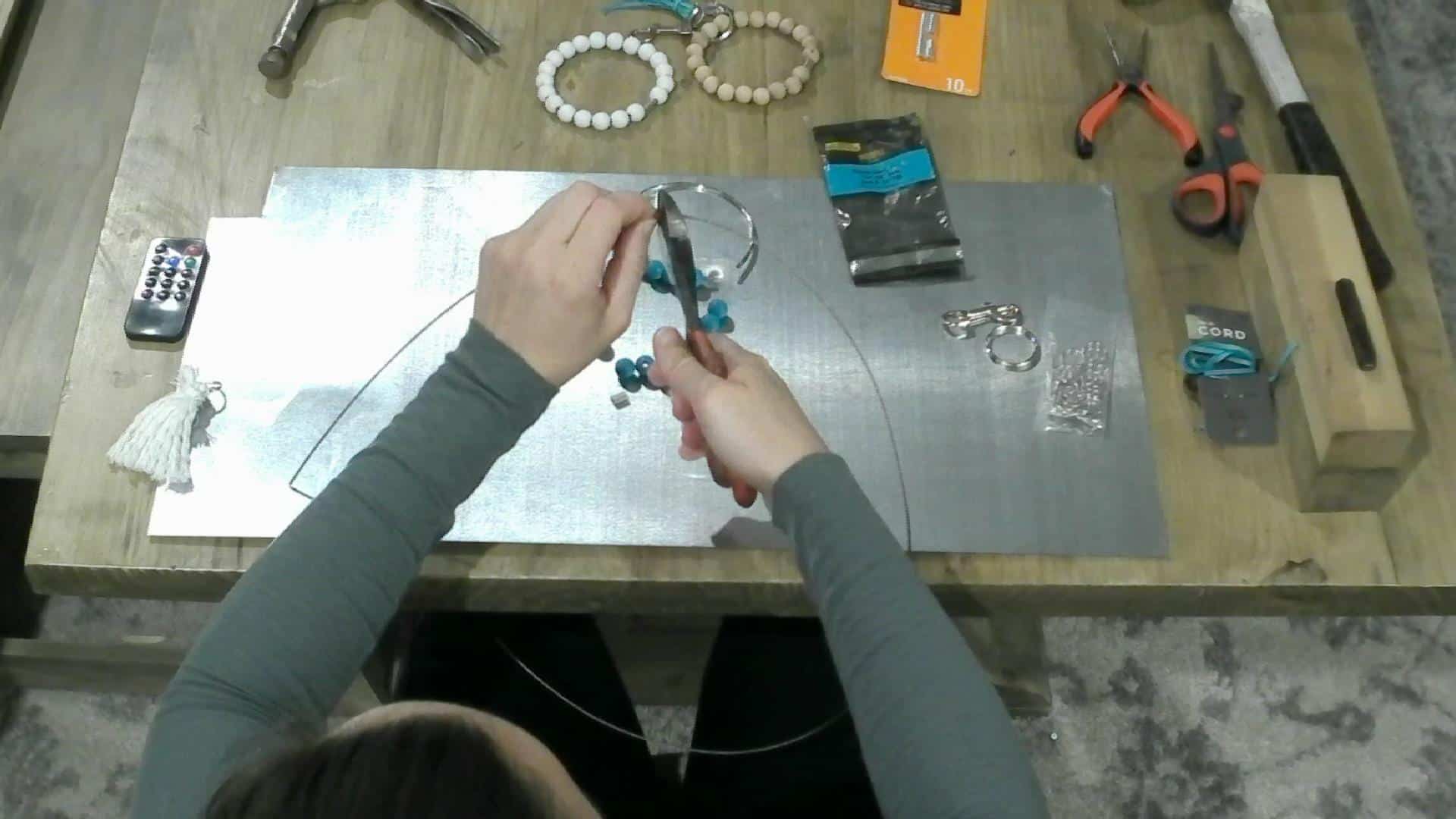 Cutting the wire for the DIY Key chain bracelet