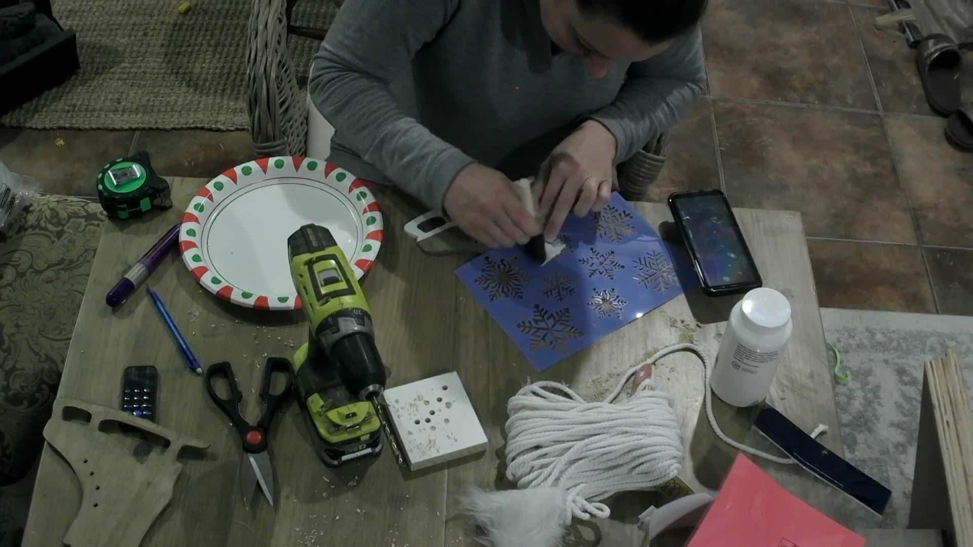 DIY Ice skate decor - painting the snowflakes on the ice skates