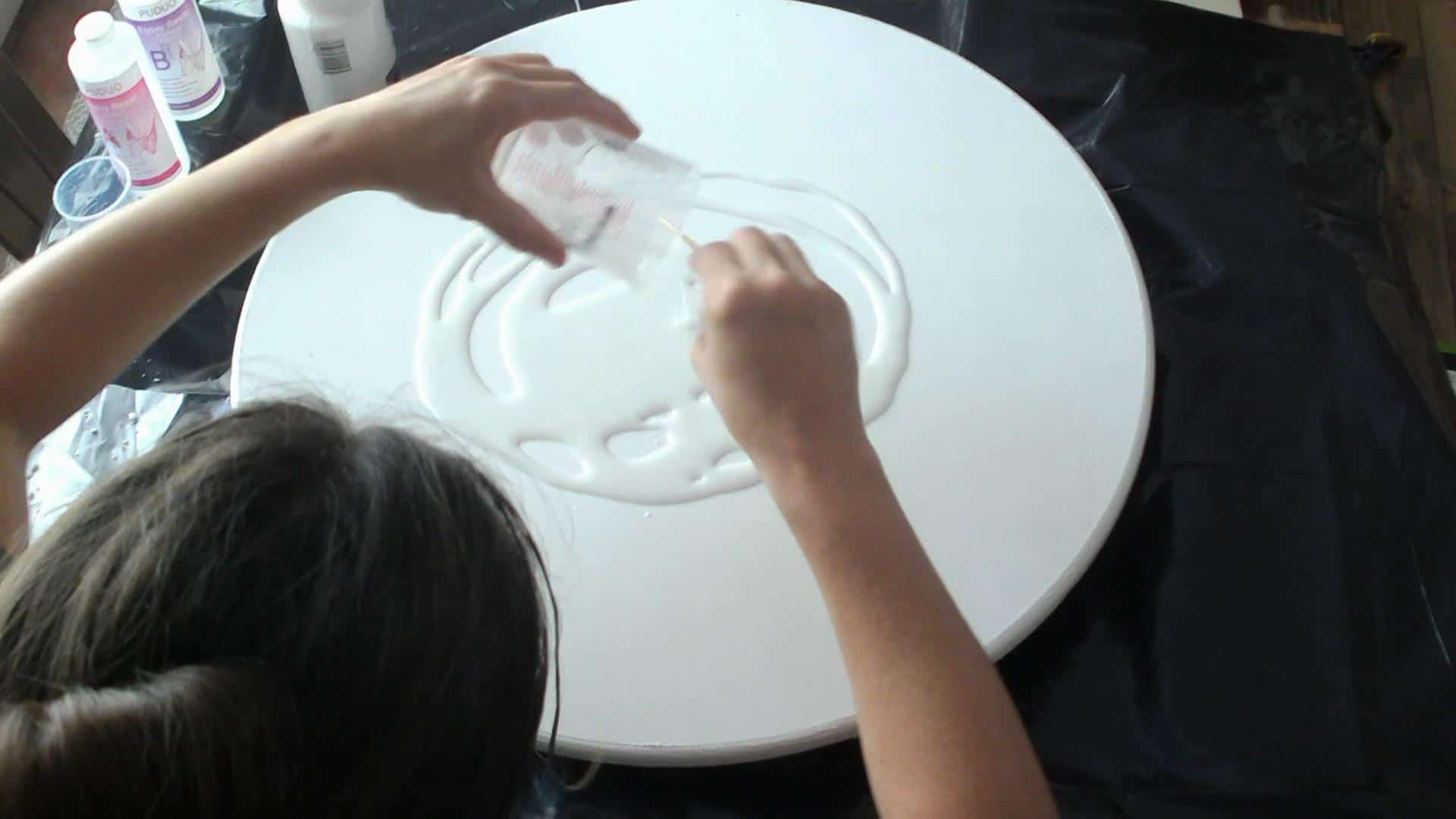 pouring the epoxy on the epoxy marble table top