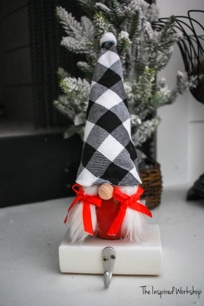 Gnome Stocking Holder with red body and black and white plaid hat