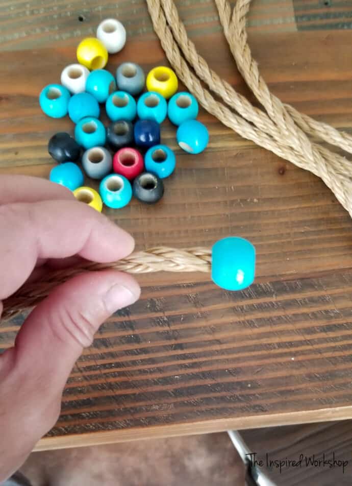 Bead glued on the end of the rope to make the ring toss rings