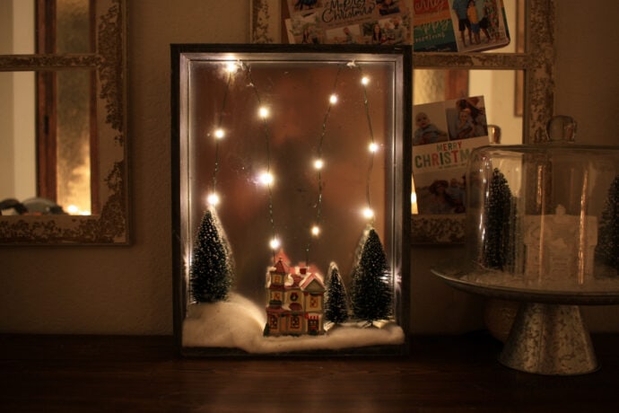 How to make a shadow box with mirrored background, fairy lights, small ceramic house with bottle brush trees