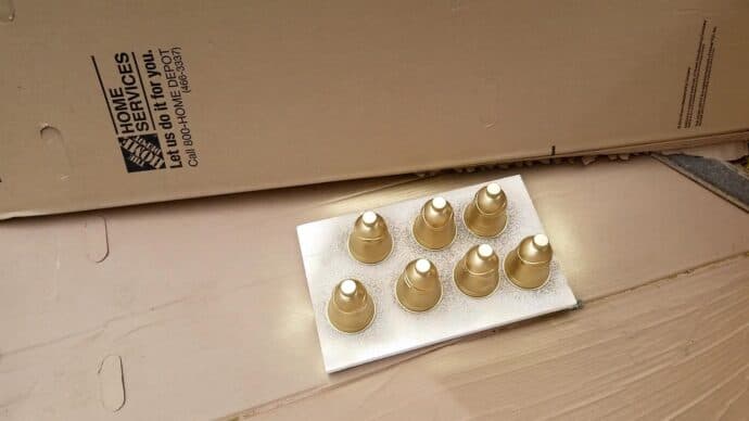 Spray painting the bells to look like vintage brass bells