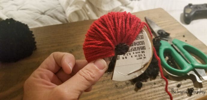 Making a pom pom for my gnome garland and I cut up the cardboard
