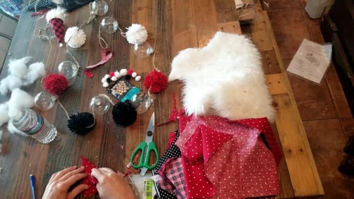 gluing the hat for the gnomes on the garland