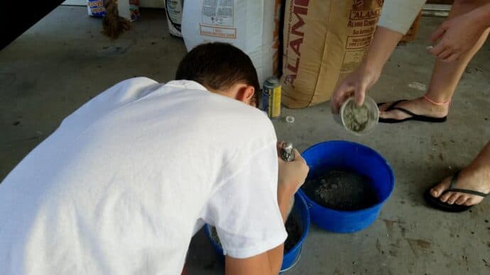 mixing the cement for the diy christmas trees