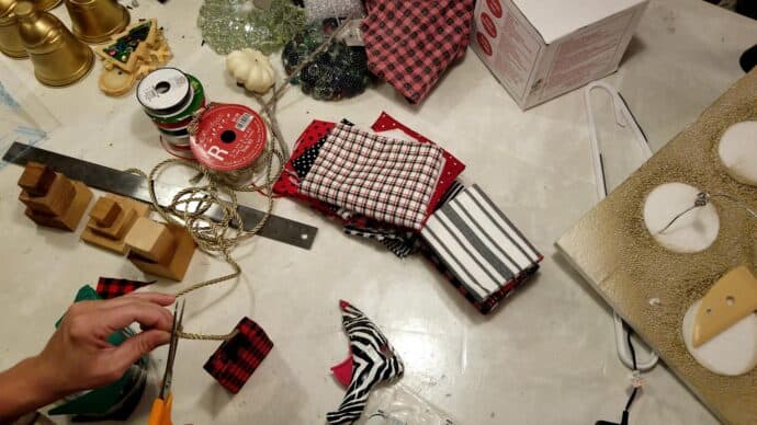 gift bag is wrapped in red and balck buffalo check fabric - starting to look like a christmas gift bag