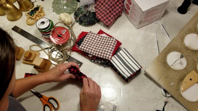 wrapping the wood to make the gift bag ornament