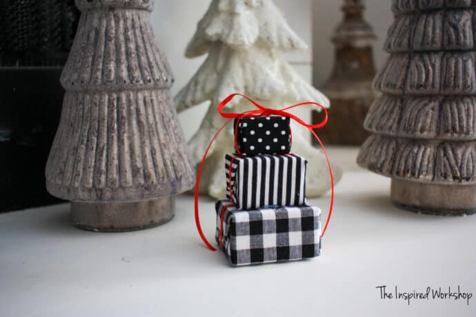 miniature Black and White wrapped gift boxes stacked and turned into an ornament