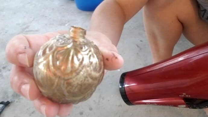 up close shot of the ornament in progress as we are making it a diy mercury glass ornament