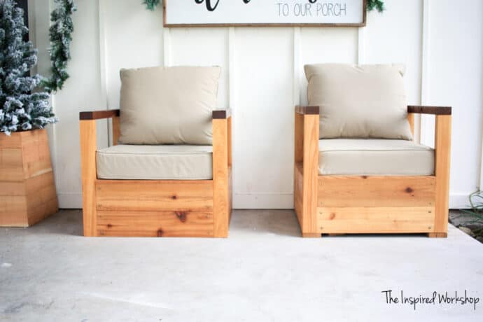 DIY Outdoor Chairs on the front porch with tan cushions and white wall behind them