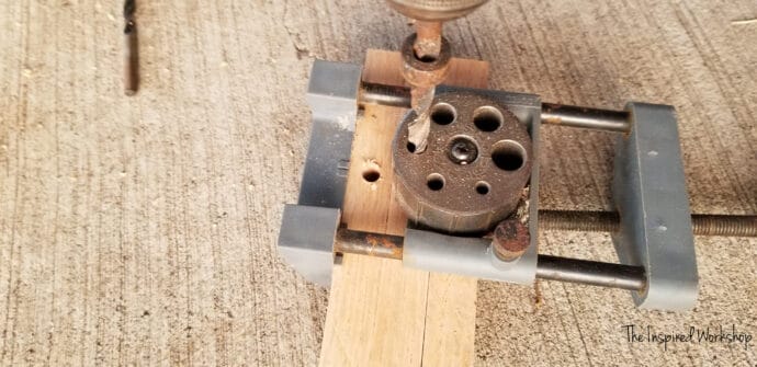 drilling more pocket holes in the top boards of the base of the small side table