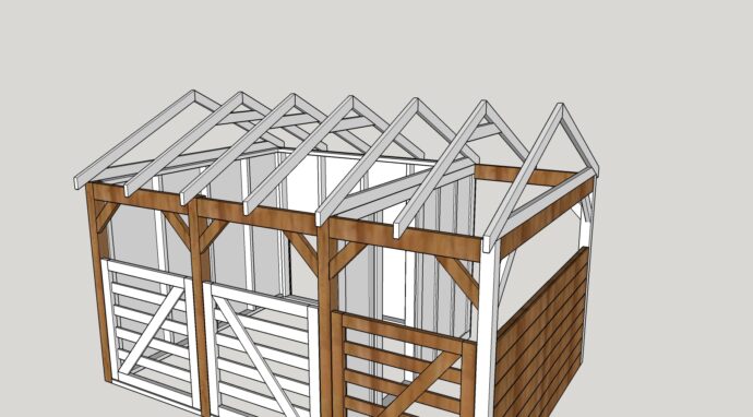 roof with all the rafters in place on the goat barn, gates in place