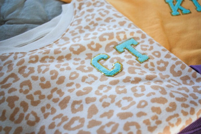 Initials patches on leopard sweatshirt 