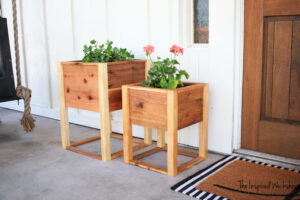 DIY Planter Boxes on porch with plants in them