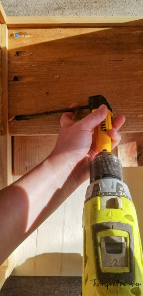 using the right angle drill attachment to attach the side to the planter box in a tight space