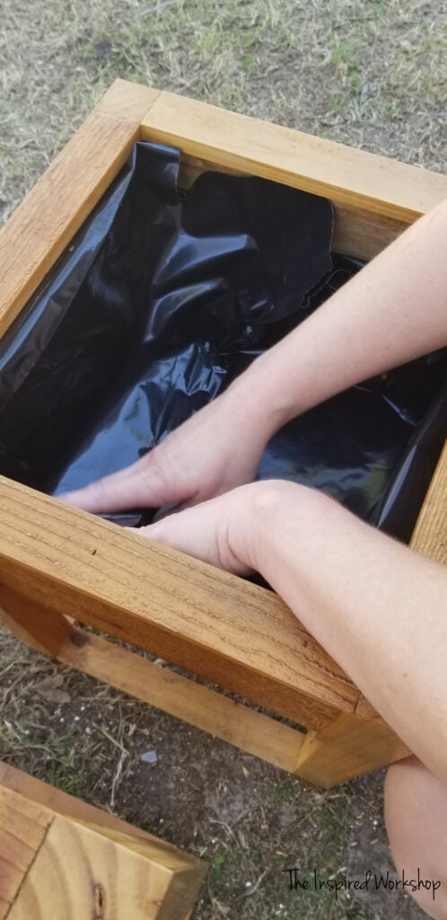 Adding a contractor bag to be the liner of my planter boxes