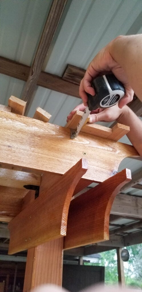 measuring for the top boards on the diy garden trellis