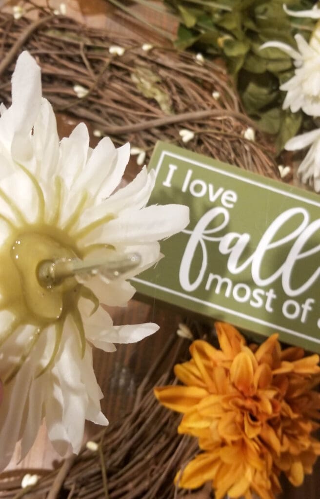 Hot glue all over the mum flower to stick in the wreath