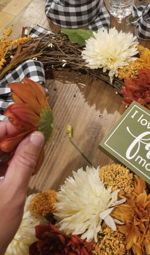 cutting the mums for the wreath