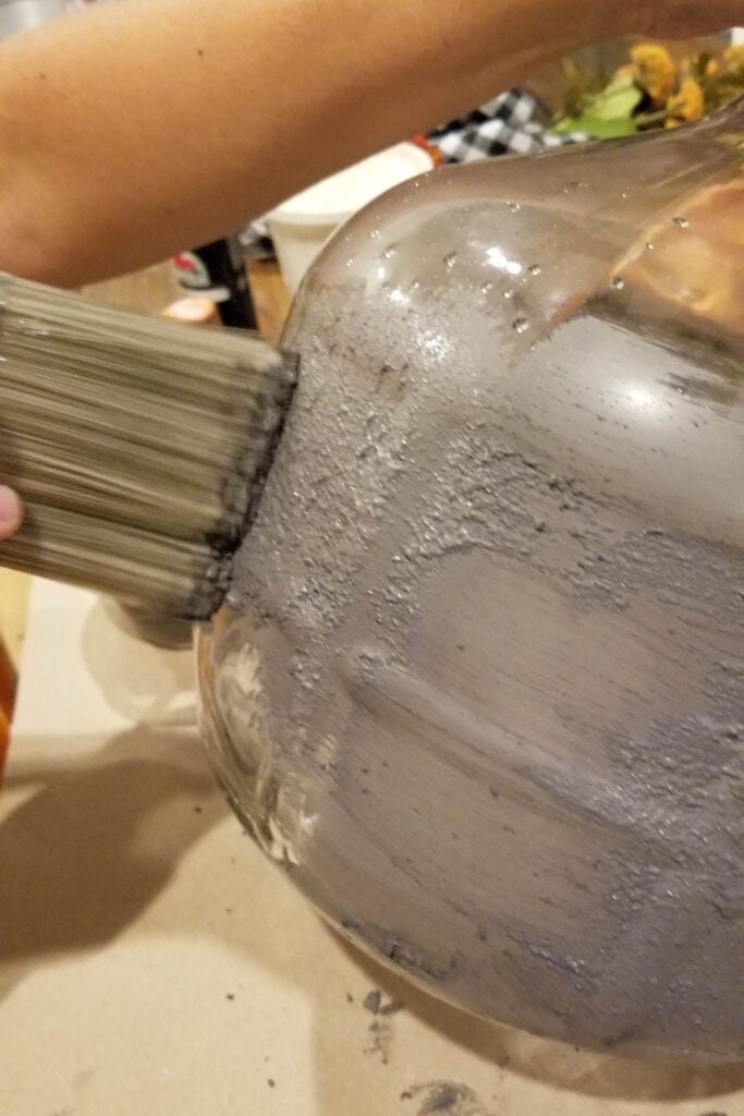 painting the glass vase with baking soda paint