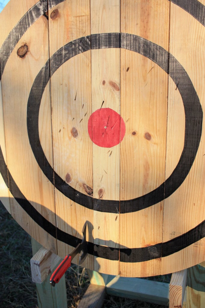 axe throwing target with axe marks after being used