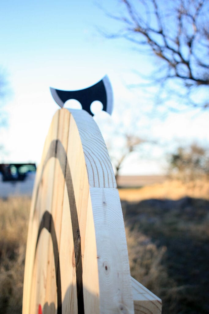 axe stuck on the back side of the target