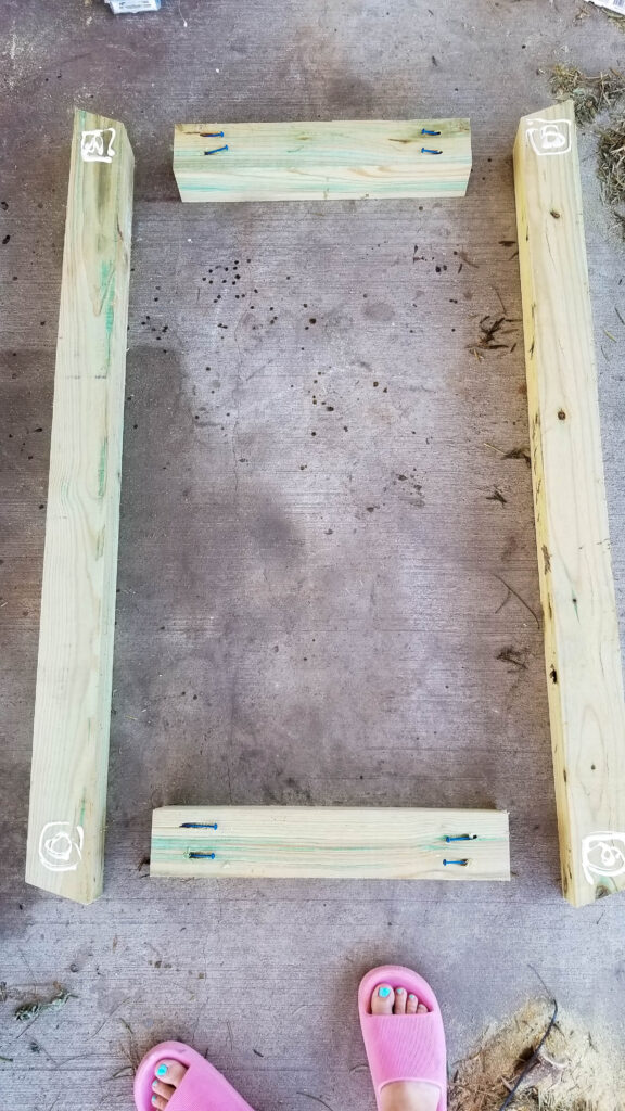 gluing the boards for the base of the axe throwing target