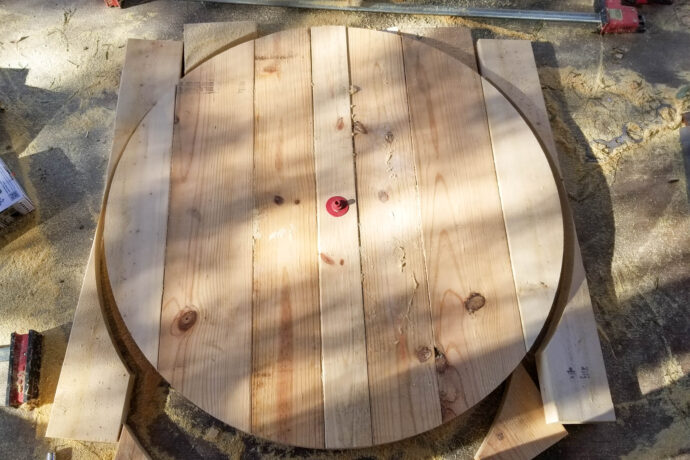 the circle breaking free after using the circle jig and router to cut the axe throwing target