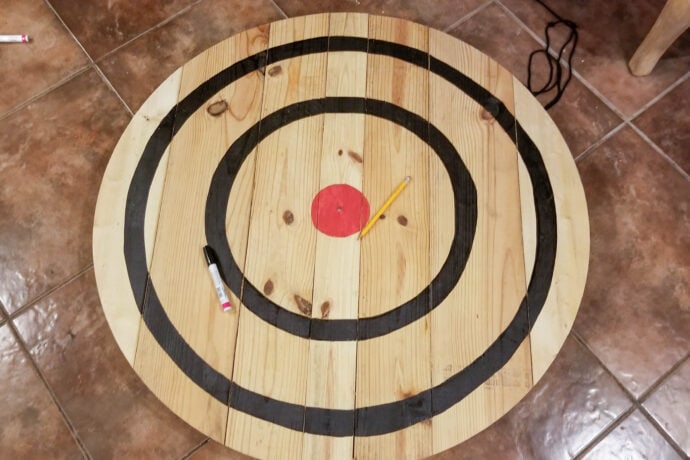 painting the circles for the axe throwing target